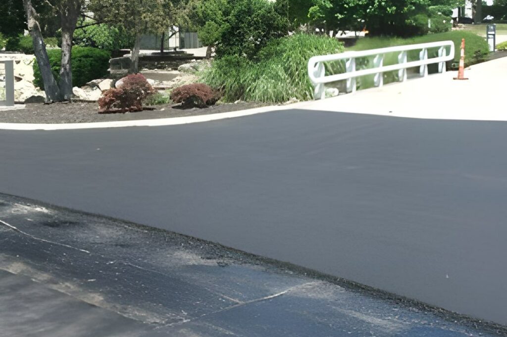 Asphalt overlay companies near me finishing a project.