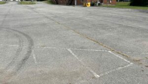 Faded line striping on a asphalt parking lot in South Carolina.