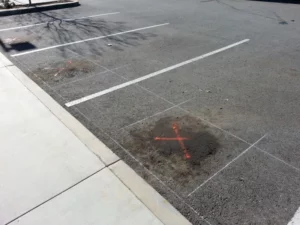 Oil spills on asphalt parking lot.